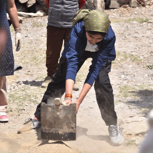 Mixing Plaster  during architectural workshop in India